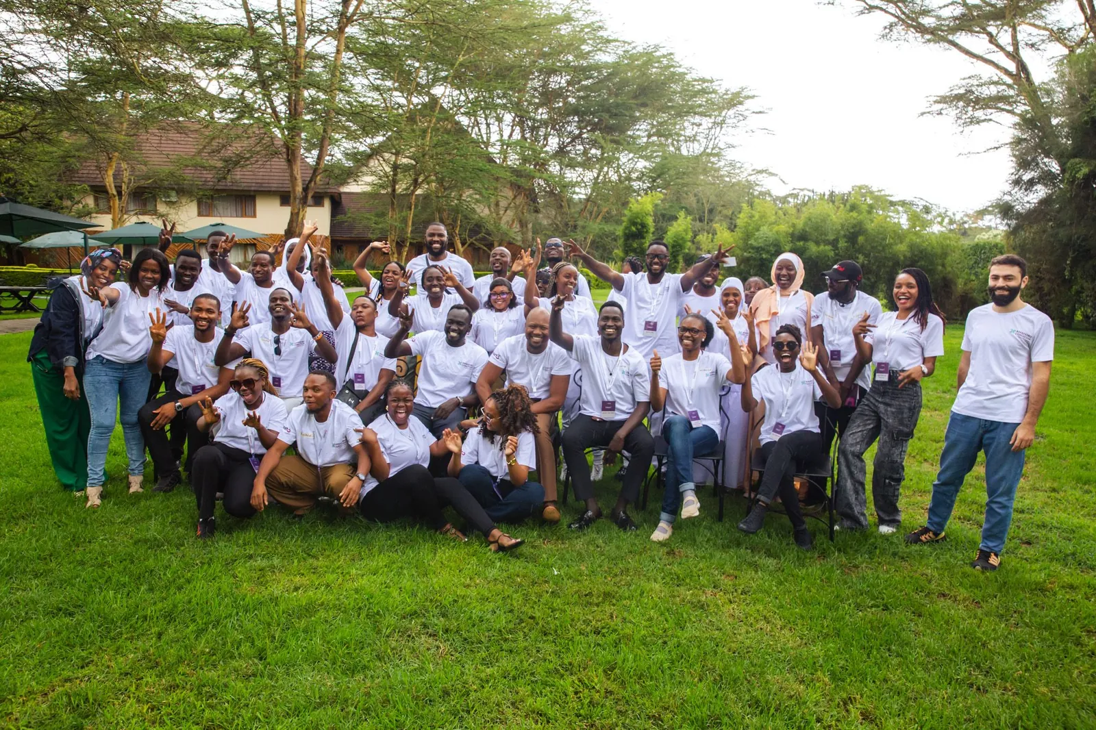 The fellows of the Amahoro Coalition Fellowship, cohort 3, gathered on a lawn in Naivasha