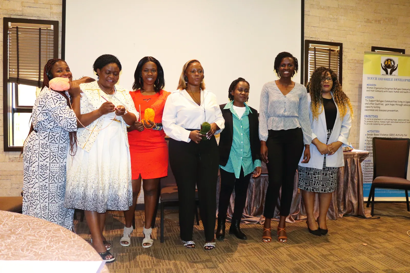 Refugee women leaders standing together during the ARWNET workshop in Nairobi