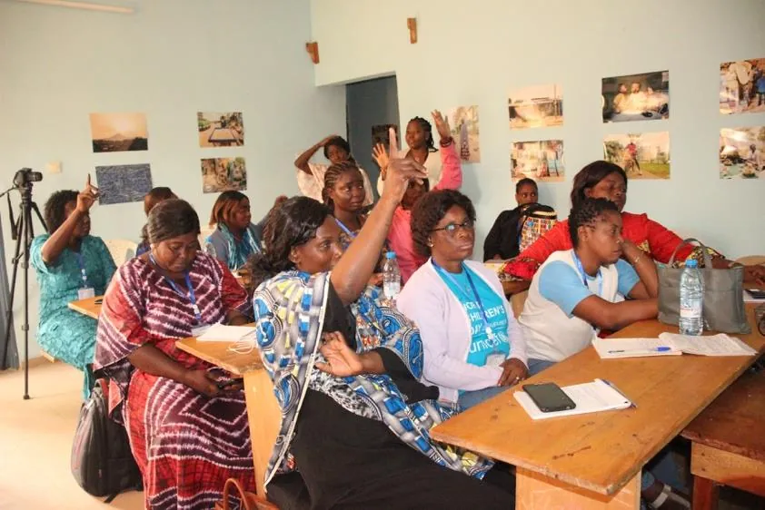 Women raising their hands during a BRIGHT session